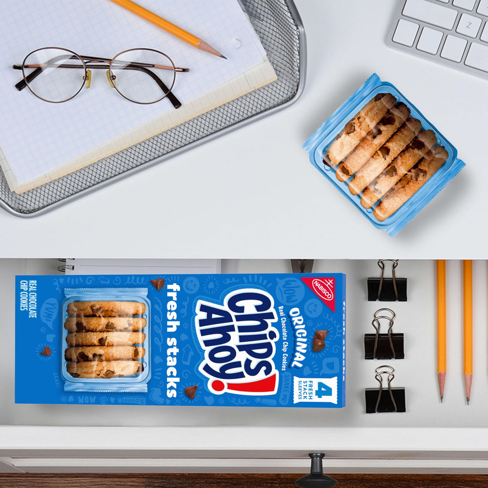CHIPS AHOY cookies served with milk in a cozy setup.