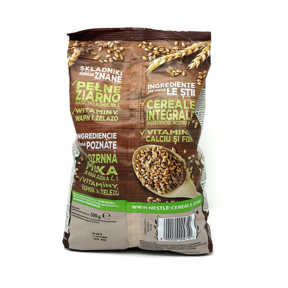 Pouring Chocapic Wholegrain chocolate cereal with milk for a satisfying aroma.
