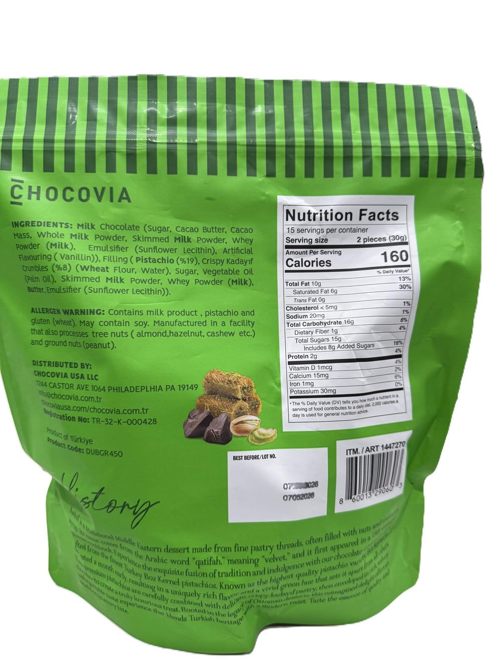 CHOCOVIA Dubai Style Milk Chocolate close-up on pistachios highlights nuttiness and texture.