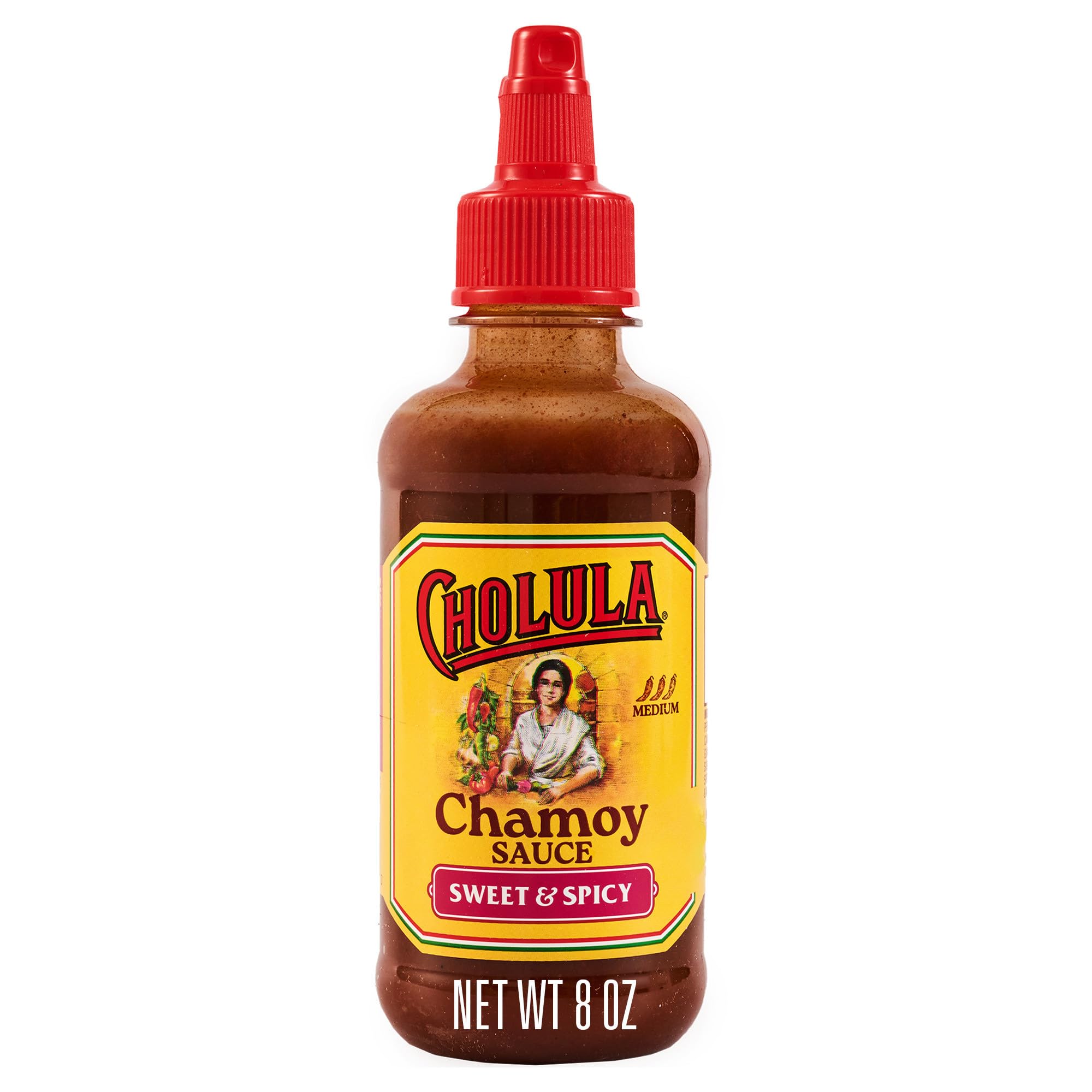Cholula Chamoy bottle pouring over fruit for a tangy-sweet drizzle