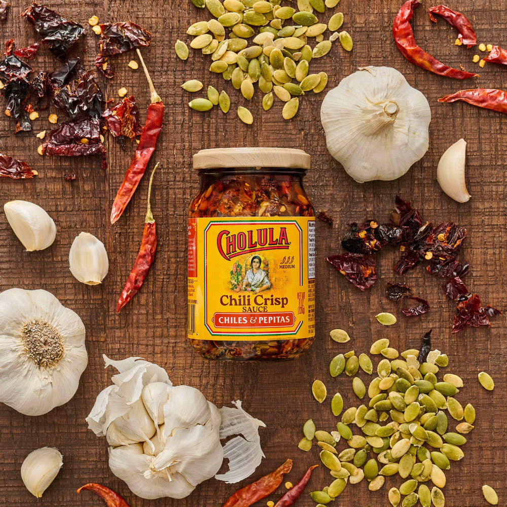 Cholula Chili Crisp bottle with wooden cap ready for serving.