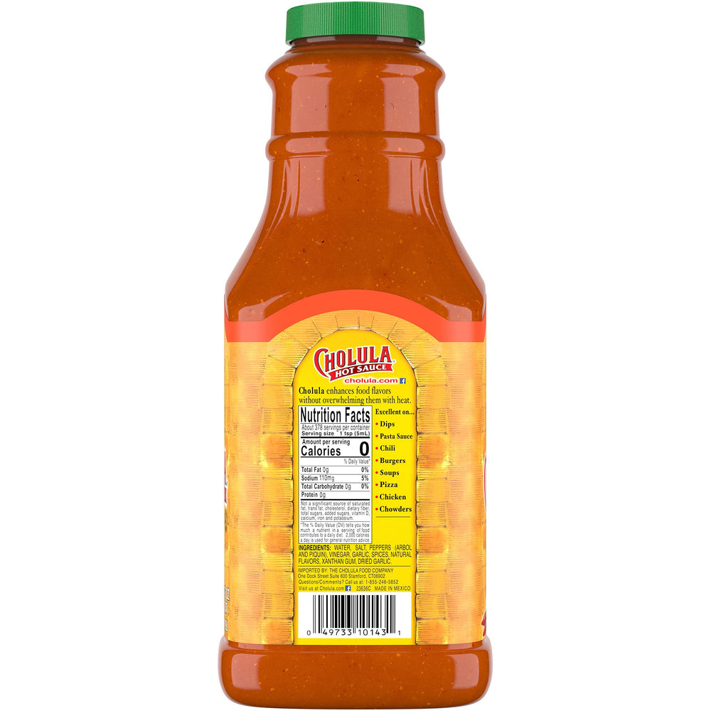 Cholula Chili Garlic Hot Sauce on fries enhances savory crunch with spice.