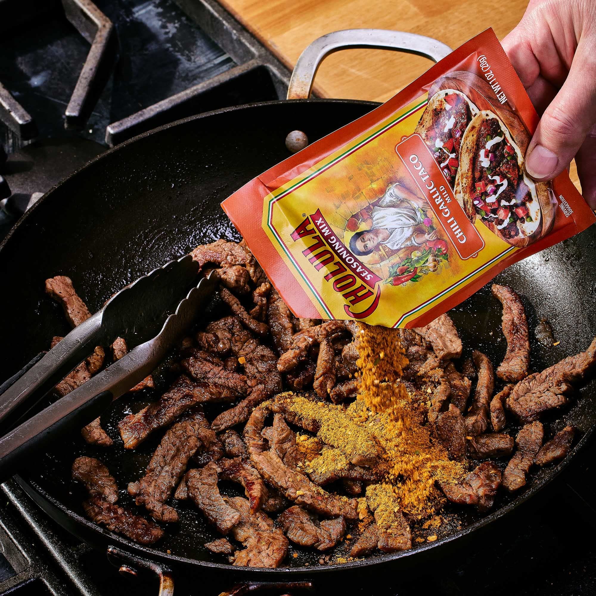 Cholula mix on shrimp tacos to elevate seafood with garlic notes.