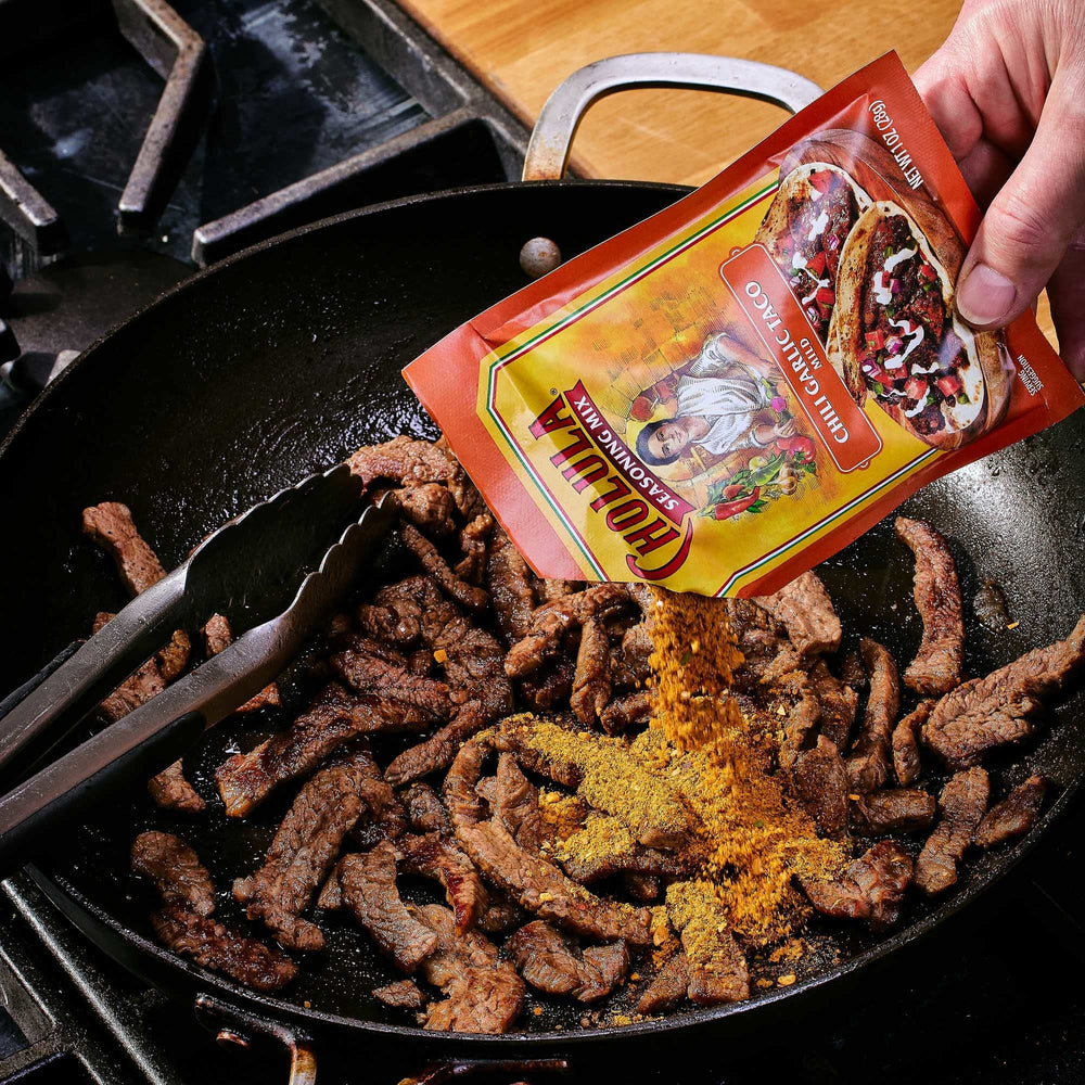 Cholula mix on shrimp tacos to elevate seafood with garlic notes.