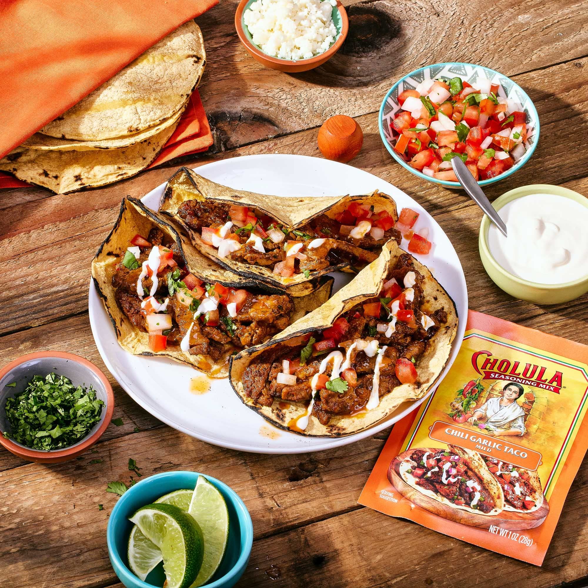 Cholula taco seasoning mix on a taco plate for vibrant weeknight meals.