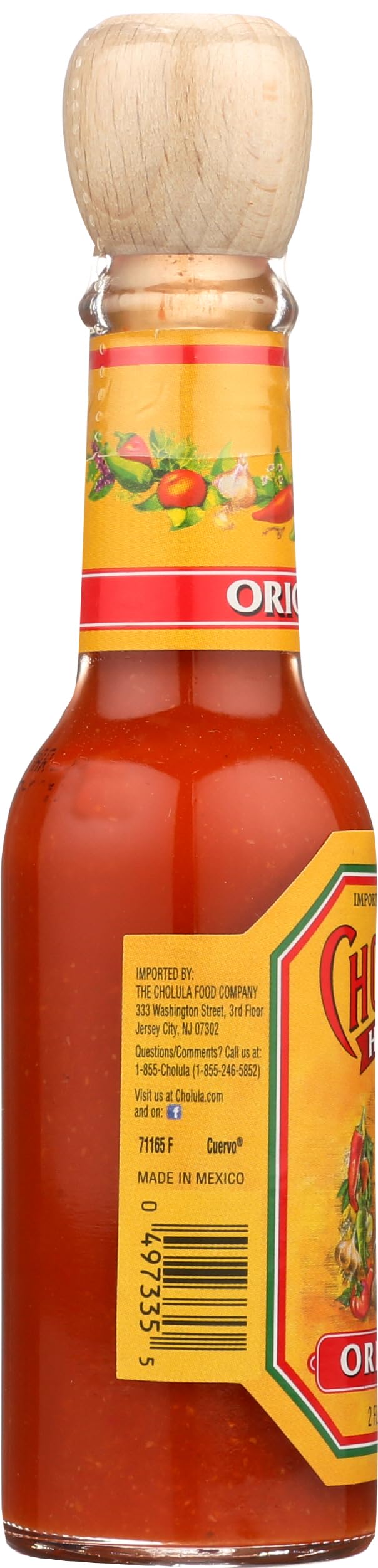 Cholula hot sauce mid-serve demonstrates topping for tacos and eggs
