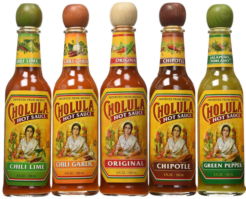 Cholula Original hot sauce bottle with signature artwork and wooden cap, elevating eggs and tacos.