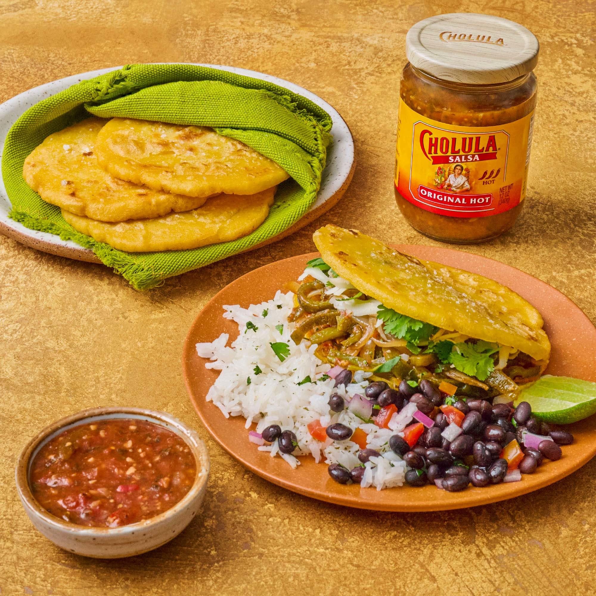 Cholula Original Hot salsa queso dish elevates flavor with kick.
