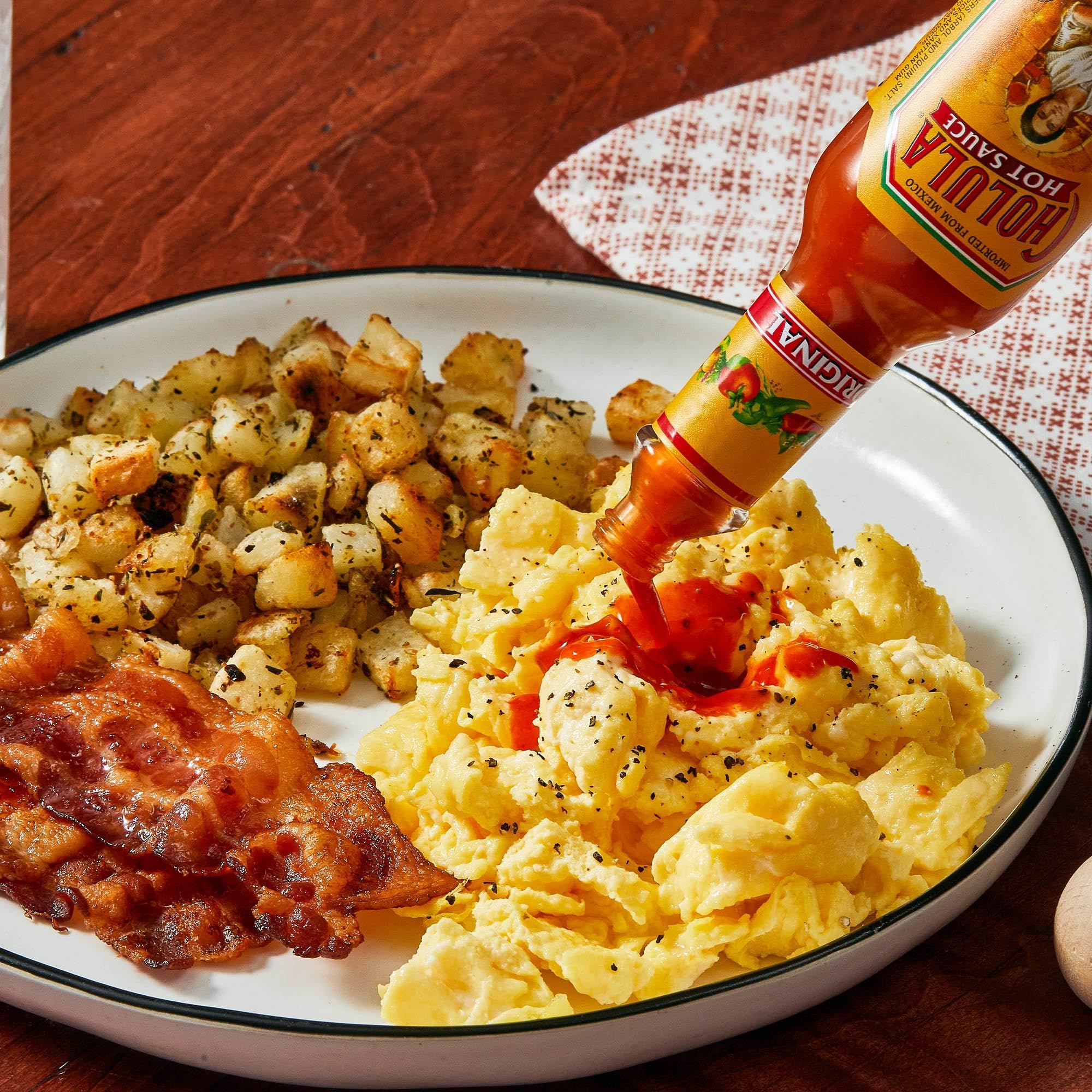 Cholula Original Hot Sauce drizzled over a burrito bowl elevates sensory profile.