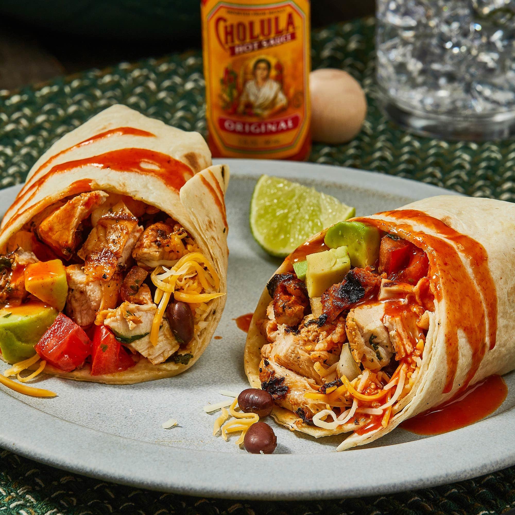 Cholula Original Hot Sauce with wooden cap on a kitchen counter adds authentic flavor.