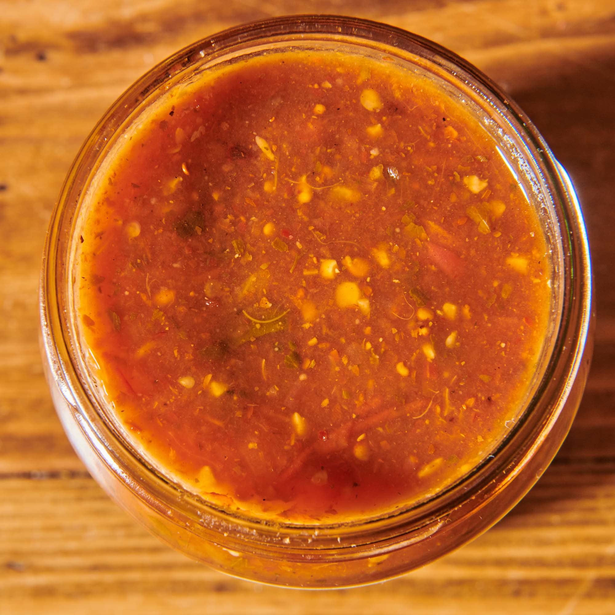 12-ounce Cholula Original Salsa bottle label visible on shelf