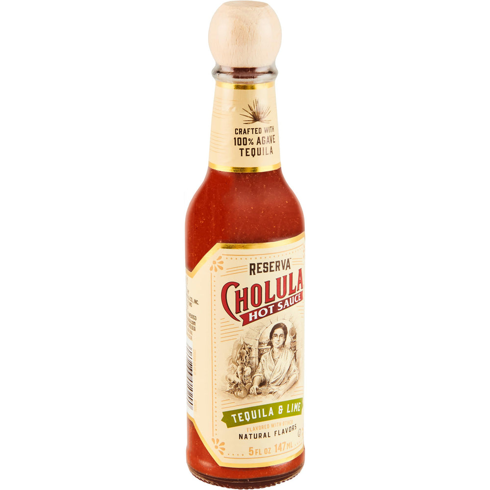 Cholula Tequila & Lime Reserva bottle pour highlights bold flavor for tacos and seafood.