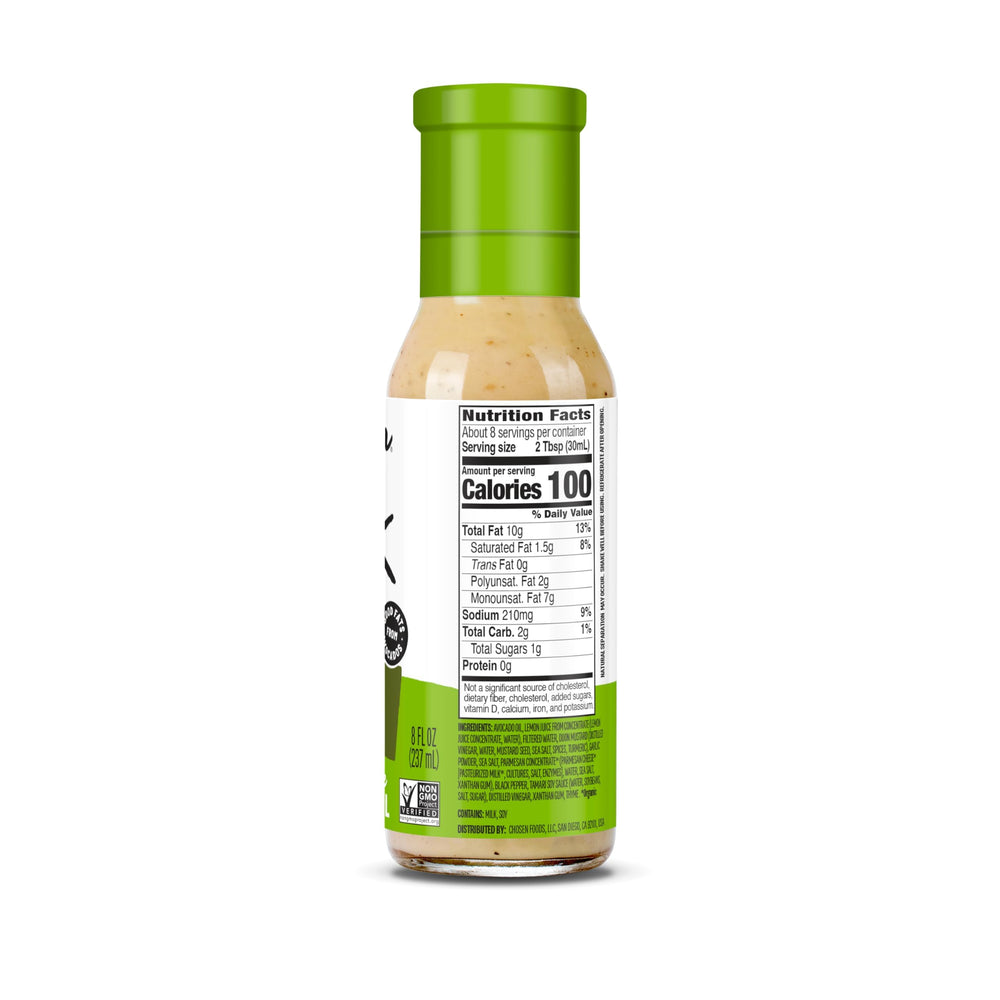 Chosen Foods Avocado Oil Caesar Dressing being poured over greens for creamy salads.