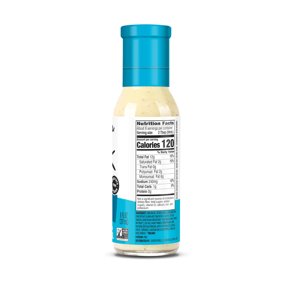 Pouring Chosen Foods avocado oil ranch dressing over a salad