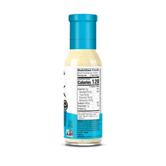 Pouring Chosen Foods avocado oil ranch dressing over a salad