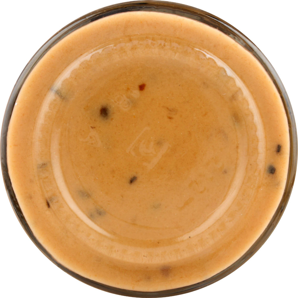Christian Potier Peppercorn Sauce bottle beside ingredients, ideal for home cooks seeking versatile flavor