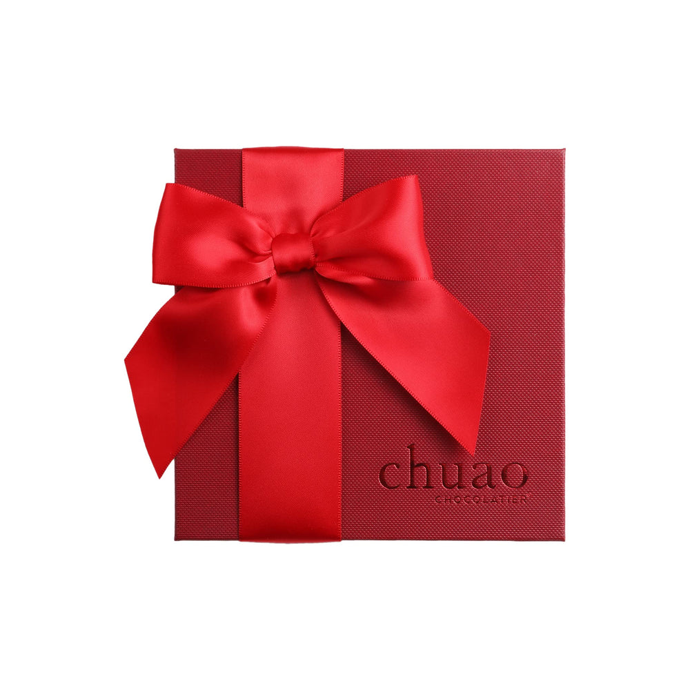 Chuao Chocolatier More Joy gift on a desk, ideal for corporate gifting.