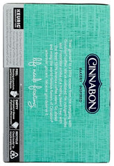 Cinnabon Classic Cinnamon Roll frosting swirl image suggesting rich aroma and indulgence.
