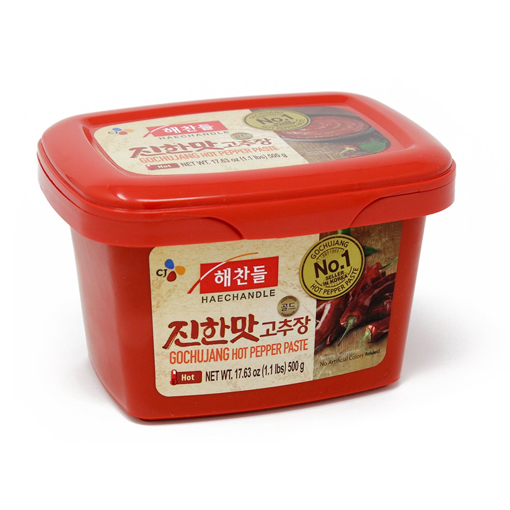 CJ Haechandle Gochujang jar pour shows a versatile base for spicy Korean dishes.