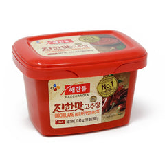 CJ Haechandle Gochujang jar pour shows a versatile base for spicy Korean dishes.