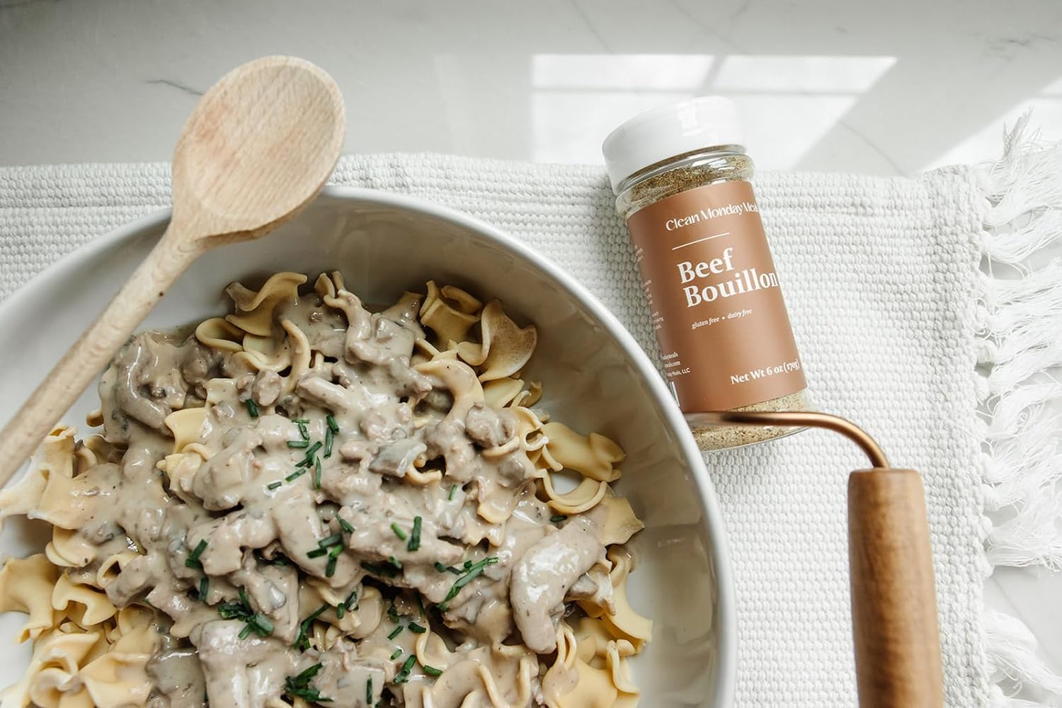 Clean Monday Meals bouillon powder dissolving in hot water for quick stock