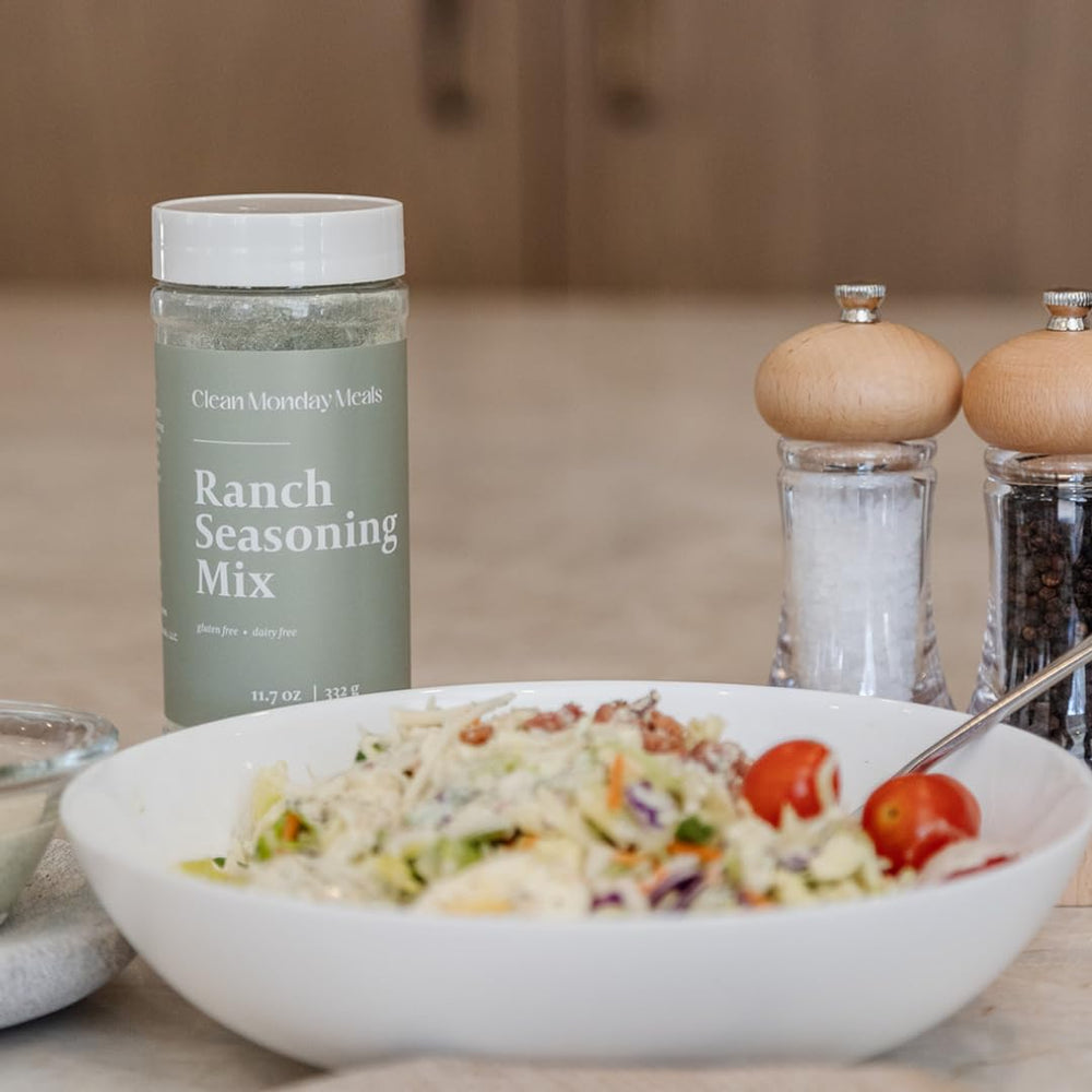 Kitchen prep scene with Clean Monday Meals seasonings for easy weeknight cooking