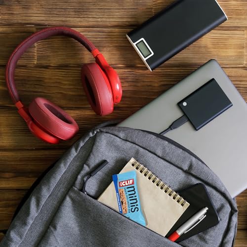 Plant-based CLIF Bar Minis as a snack option on a desk or bag.
