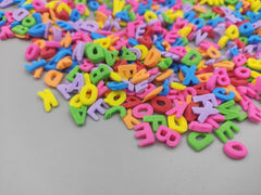 Clonynix alphabet sprinkles cake topper enhances school-start desserts with playful edible letters.