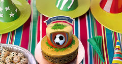 Clonynix football-field sprinkles used as cake toppers for festive treats.
