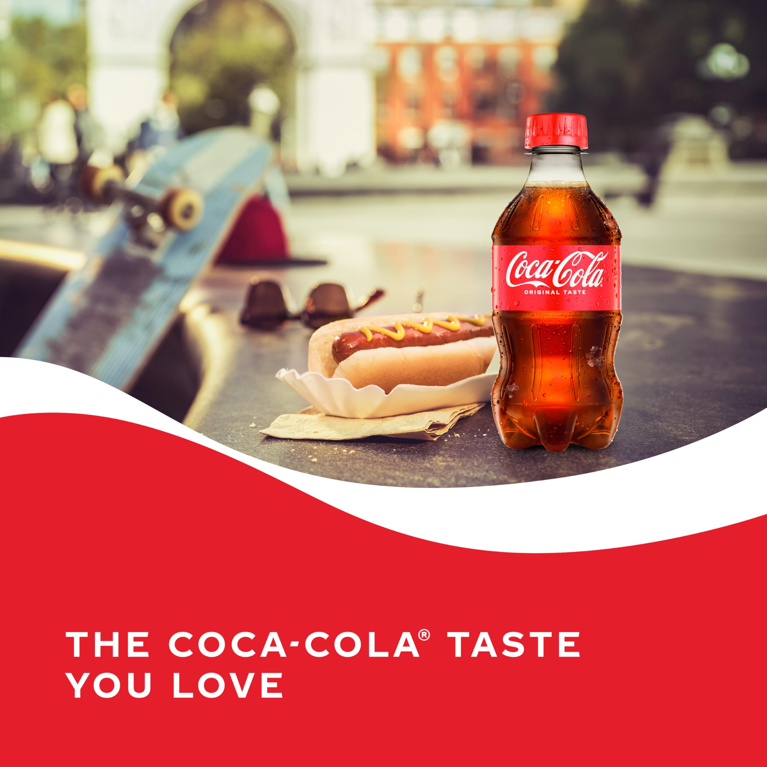 Coca-Cola ice-cold pour into a glass for refreshment.