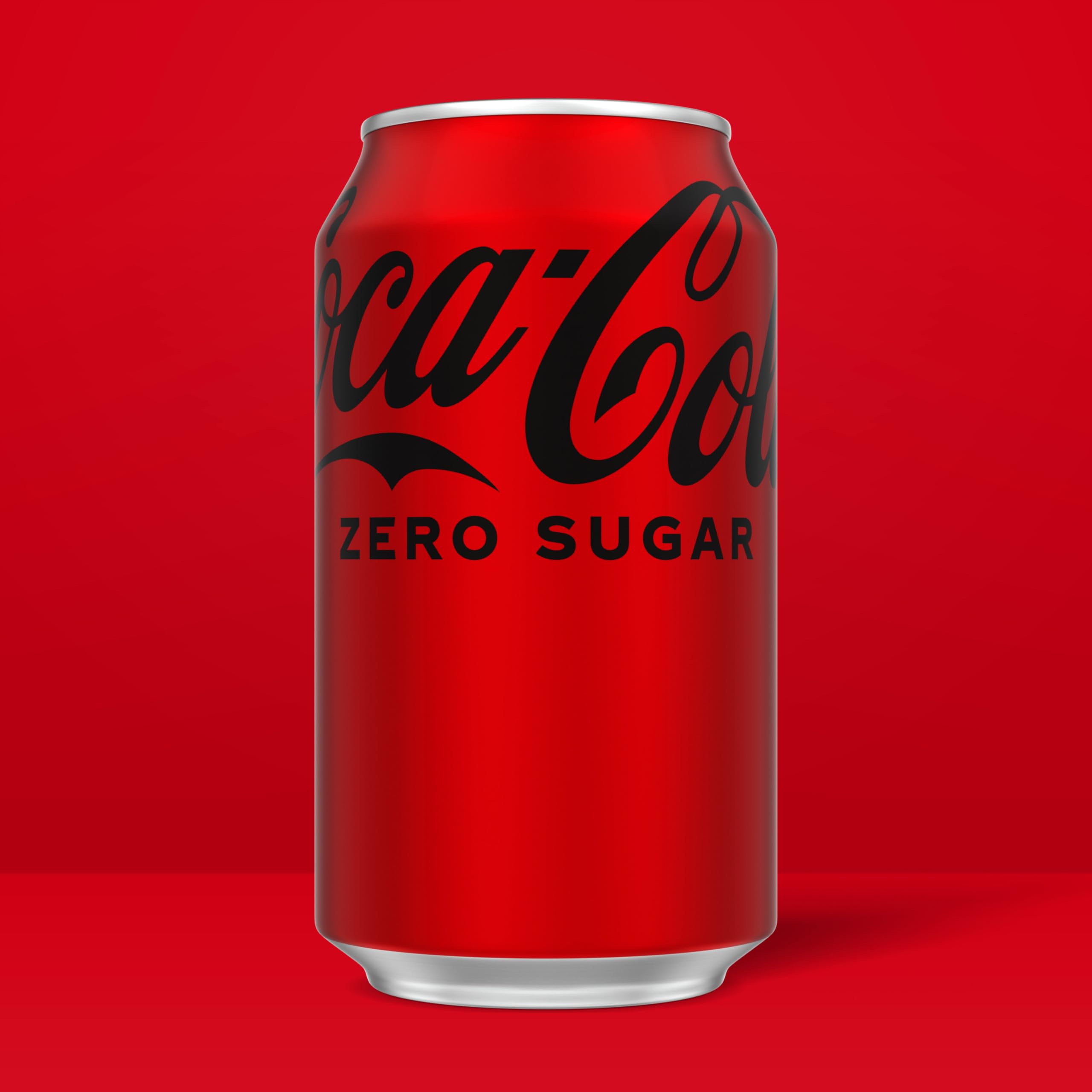 Coca-Cola Zero Sugar can closeup emphasizes bold branding and fizzy bubbles.