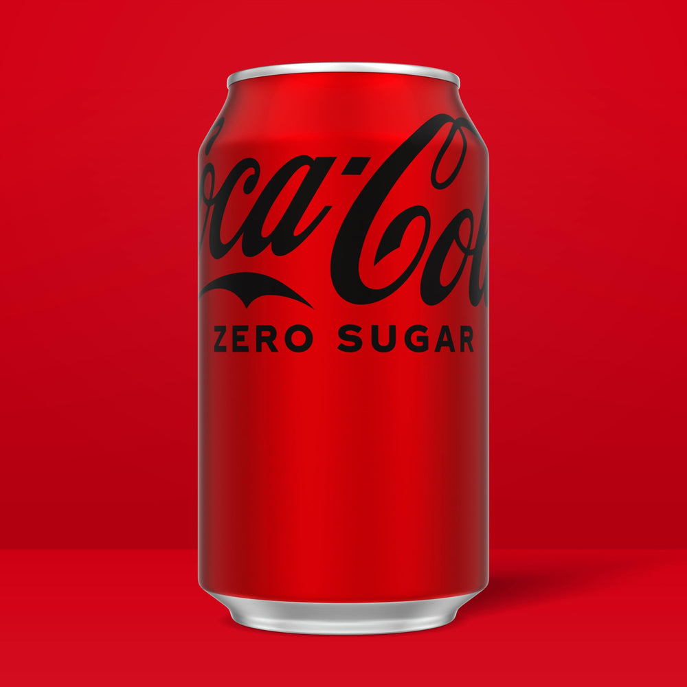 Coca-Cola Zero Sugar can closeup emphasizes bold branding and fizzy bubbles.