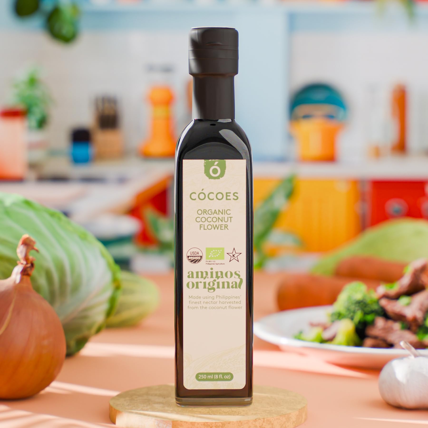 COCOES Coconut Aminos dressing being poured on a salad, low glycemic option