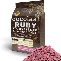 Cocoläat Ruby couverture chips in gold foil pouch ready for fresh baking.
