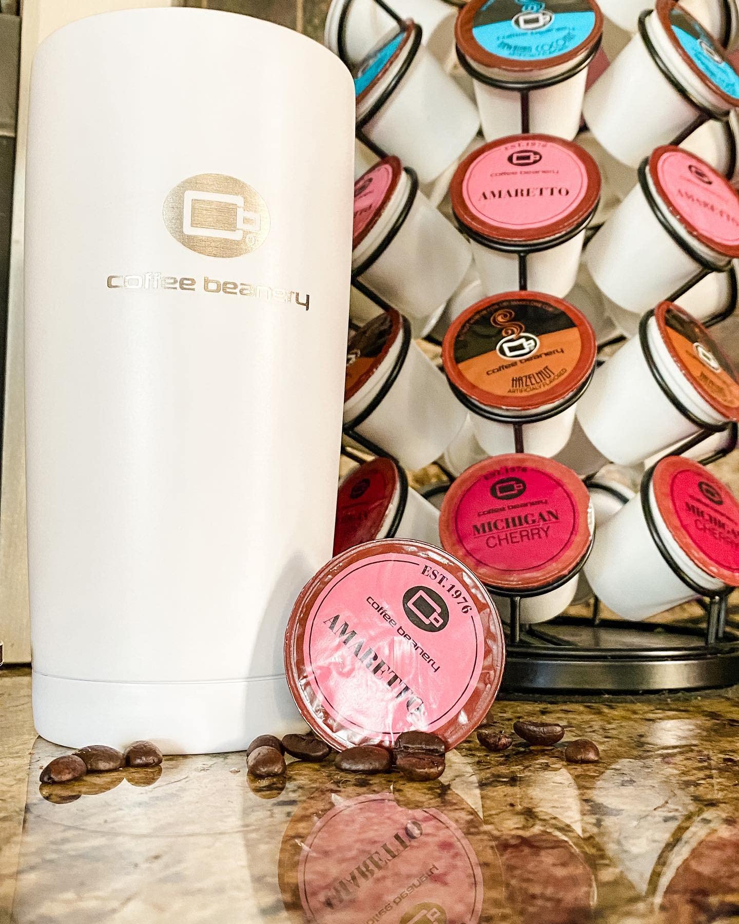 Coffee Beanery Amaretto pods in a brew-setup, compatible with K-Cup brewers.