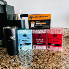 Coffee Beanery Michigan Cherry Pods brewing with a hot cup for versatile enjoyment