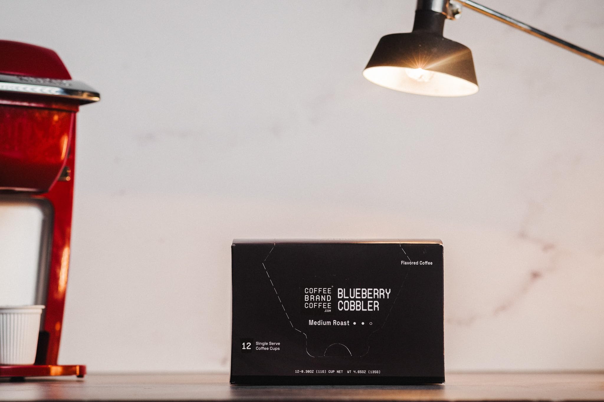 Coffee Brand 12-Pack Display highlights convenient bulk purchase and giftable packaging.