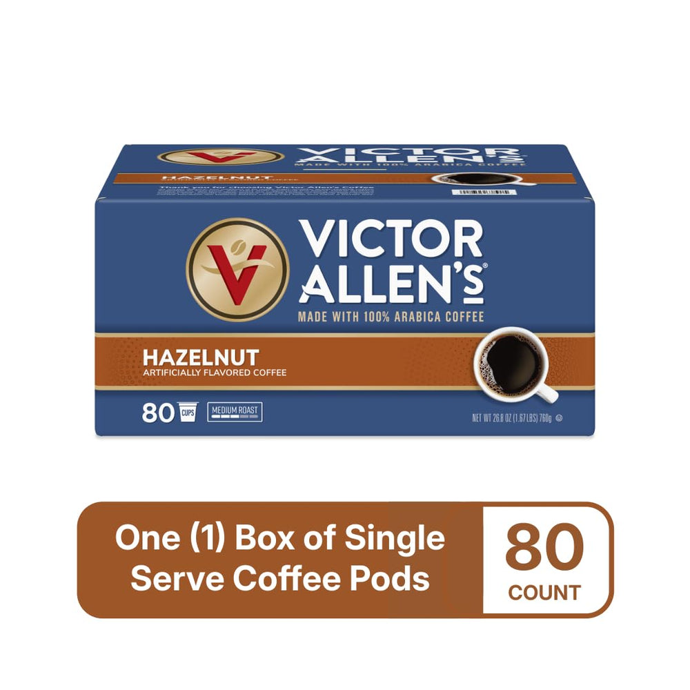 Hazelnut coffee cup steaming beside Victor Allen's hazelnut pods