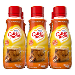 Coffee Mate Hazelnut Creamer pour into a cup for creamy coffee