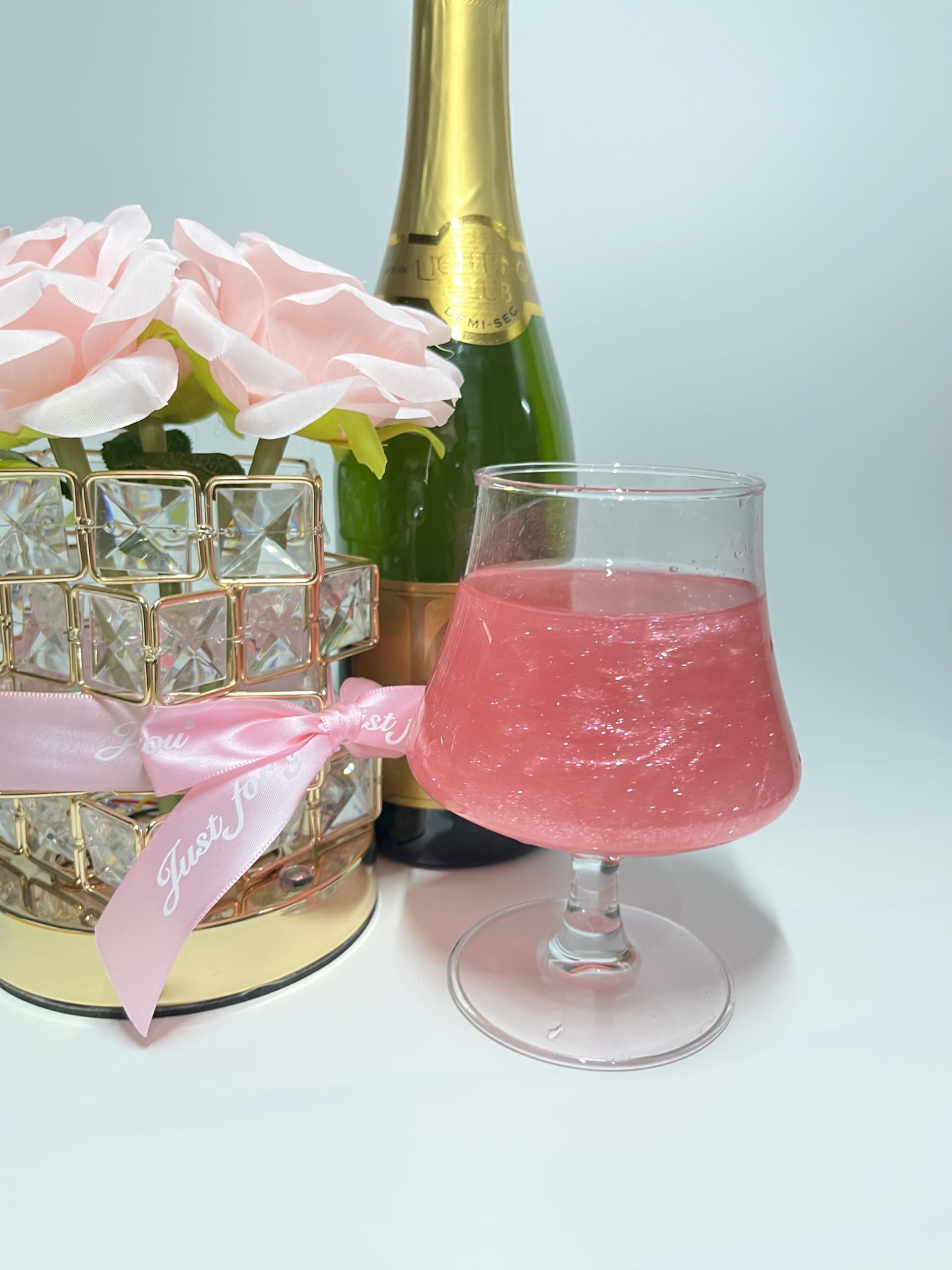 Colaele pink glitter dust on strawberries for sparkling treats.