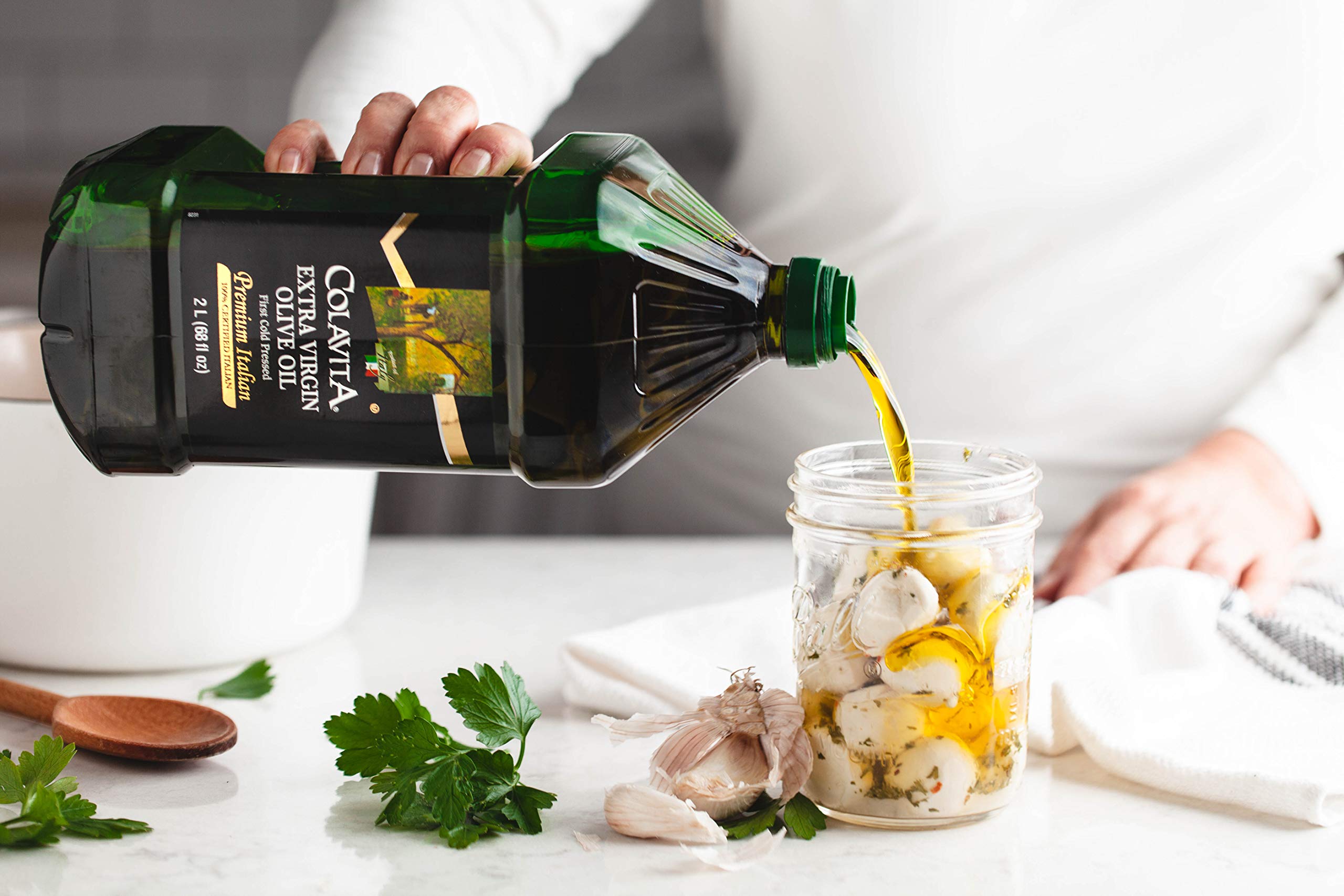 Colavita olive oil drizzled over meats and seafood