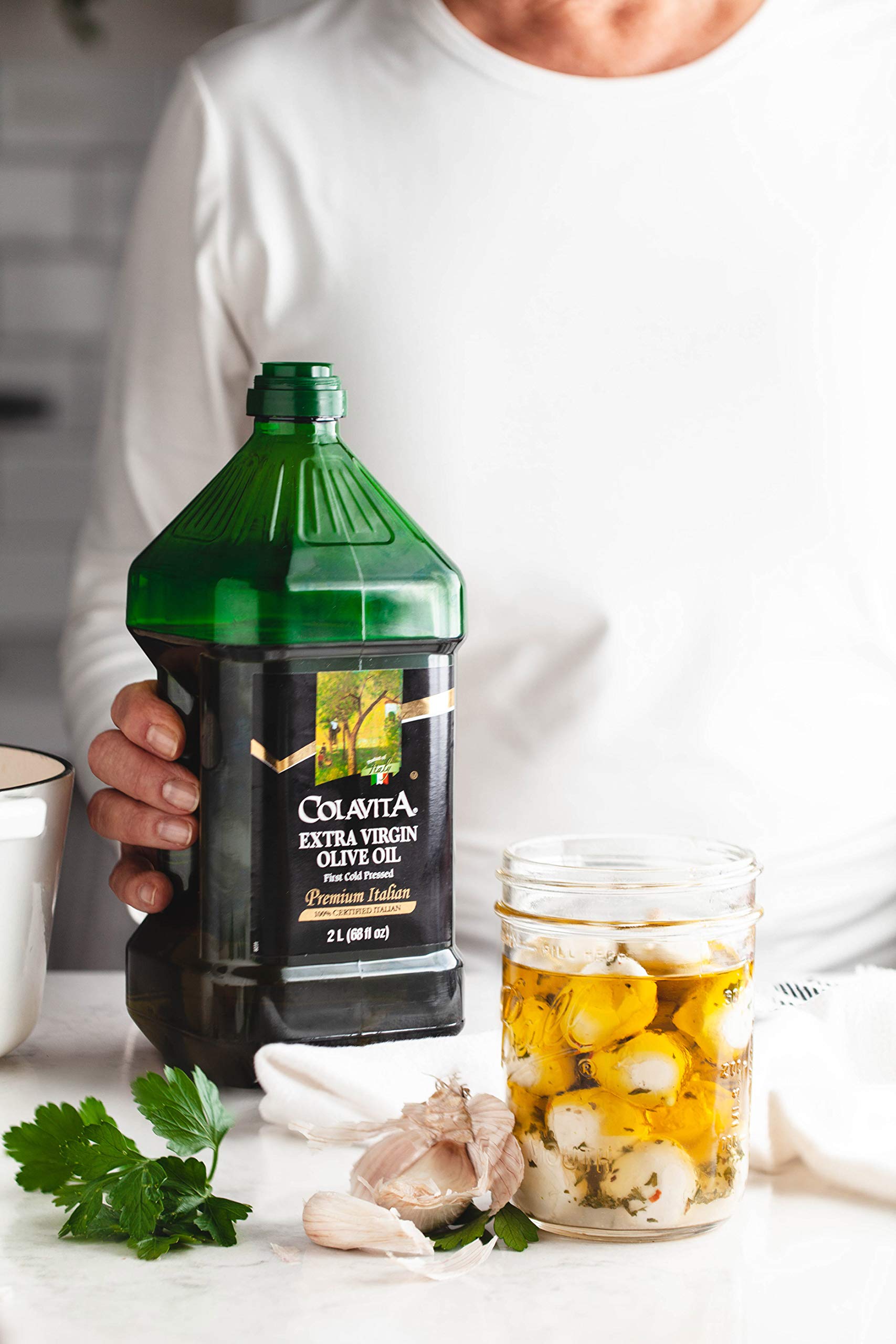 Colavita EVOO drizzled with cheese for enhanced flavor