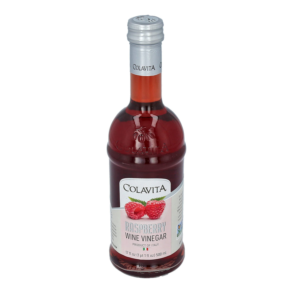 Colavita Raspberry Red Wine Vinegar with glass dressing on greens
