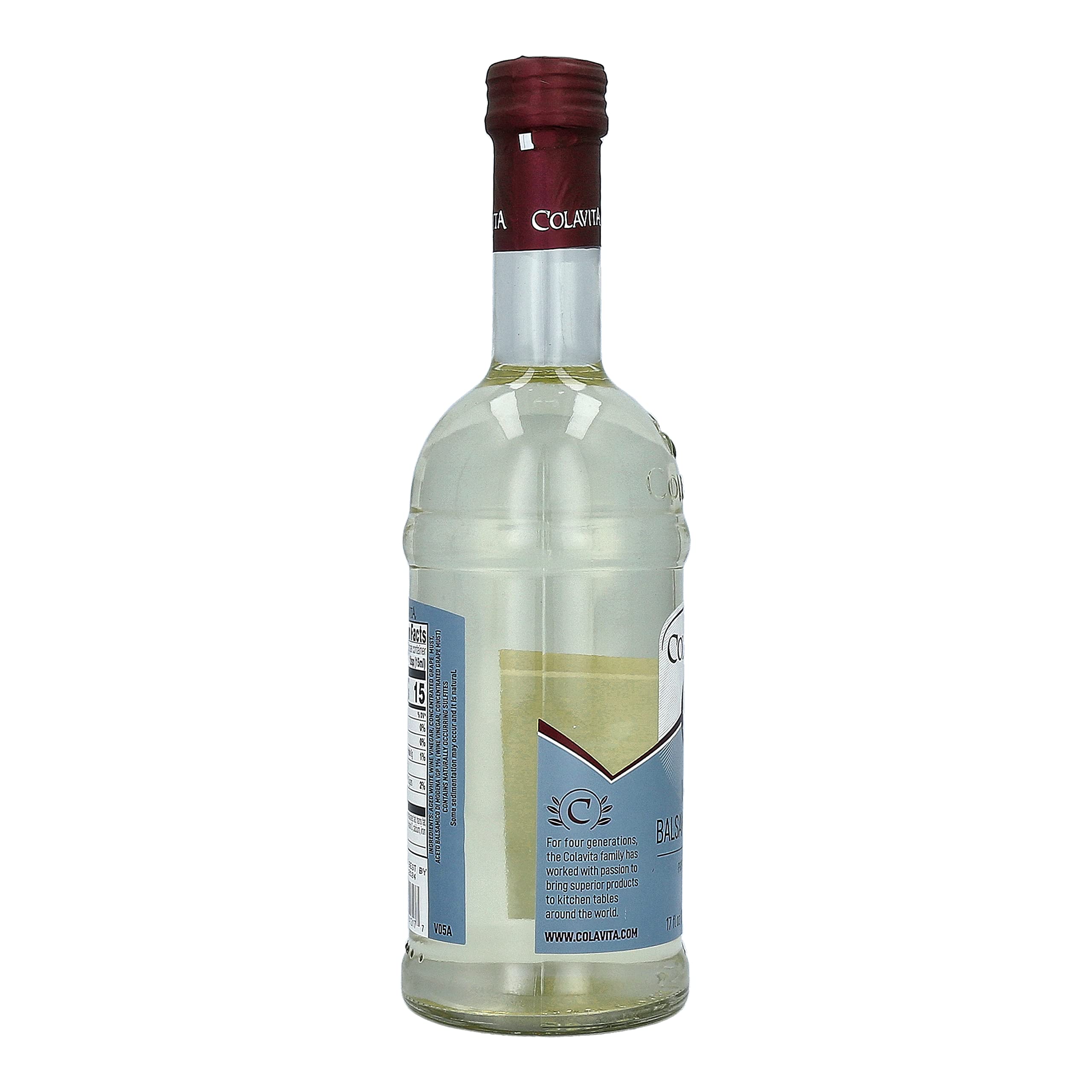Colavita White Balsamic Vinegar bottle highlighted beside white meats.