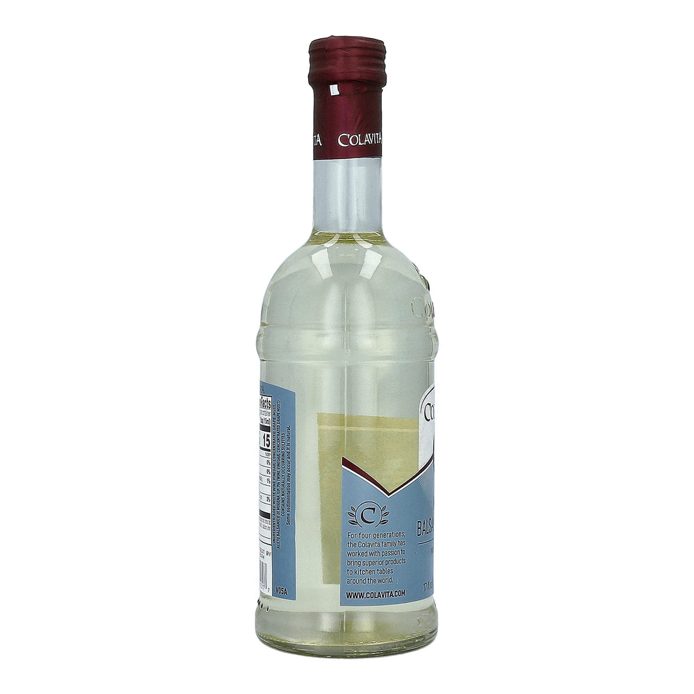 Colavita White Balsamic Vinegar bottle highlighted beside white meats.