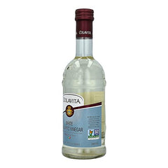 COLAVITA White Balsamic Vinegar over salad bowl, elevating flavors without overpowering greens.