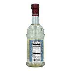 Colavita White Balsamic Vinegar being drizzled on vegetables to brighten color.