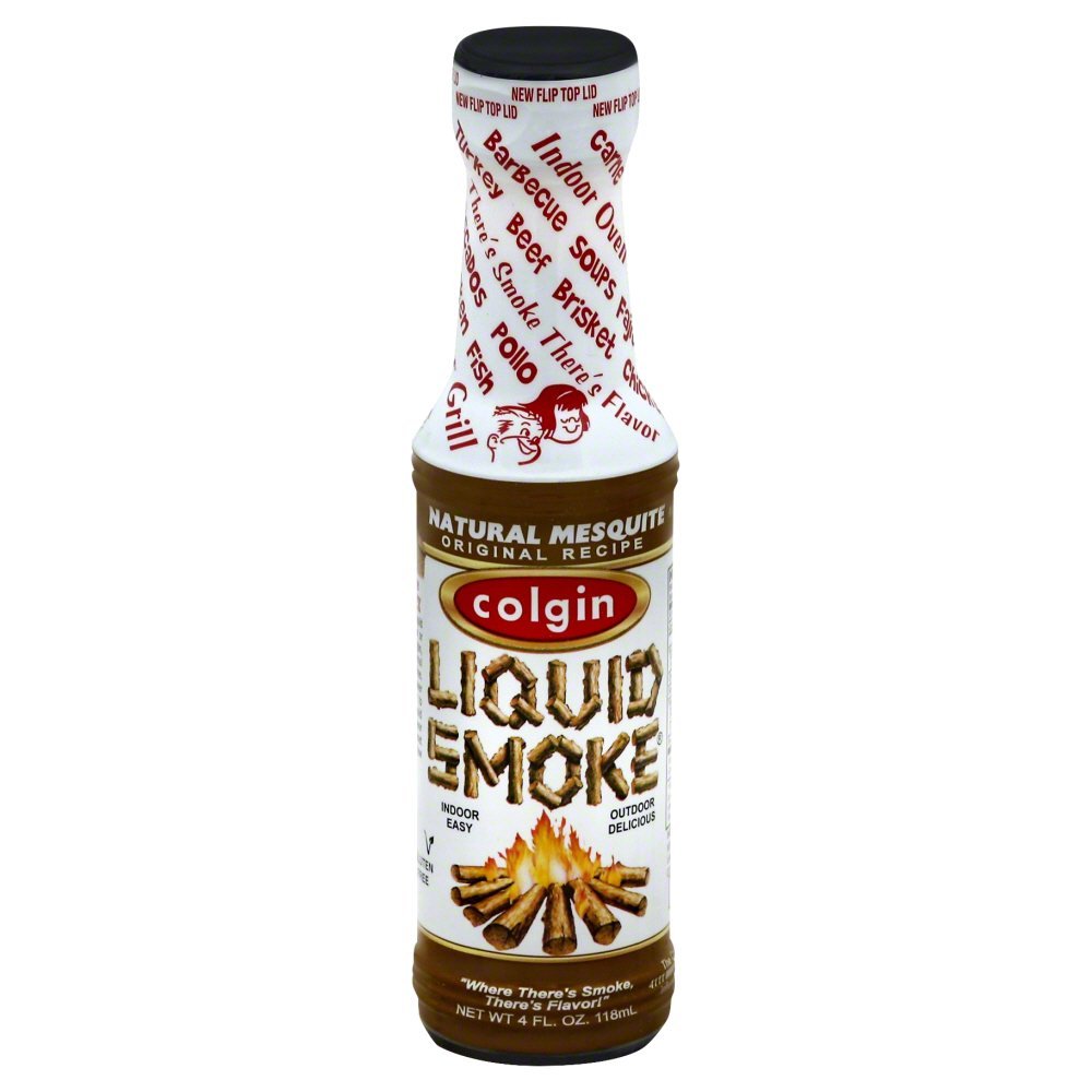 Colgin Mesquite Liquid Smoke bottle pour enhances marinades and grilling flavors