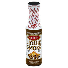 Colgin Mesquite Liquid Smoke bottle pour enhances marinades and grilling flavors