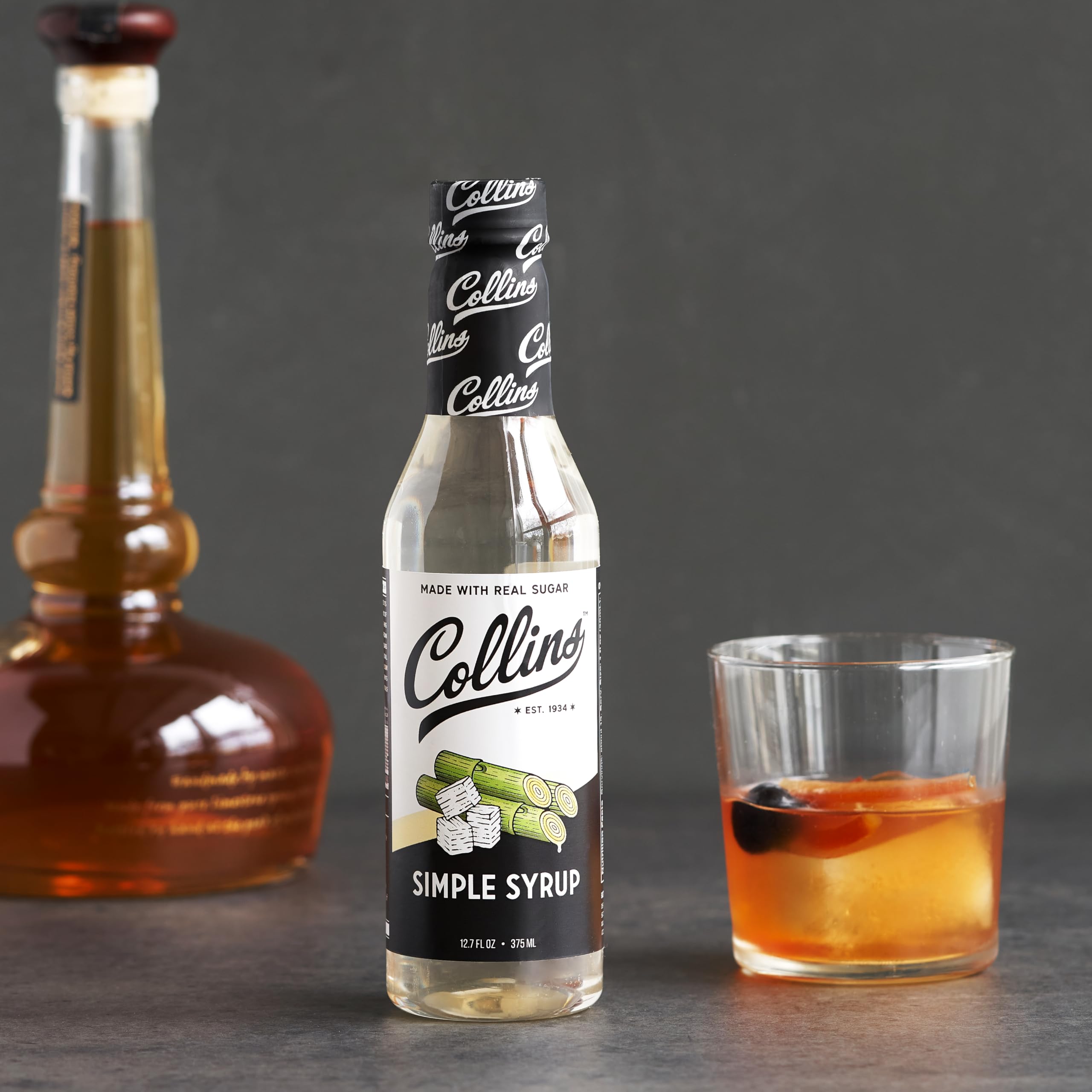 Collins Chicago Simple Syrup beside ice for batch drinks